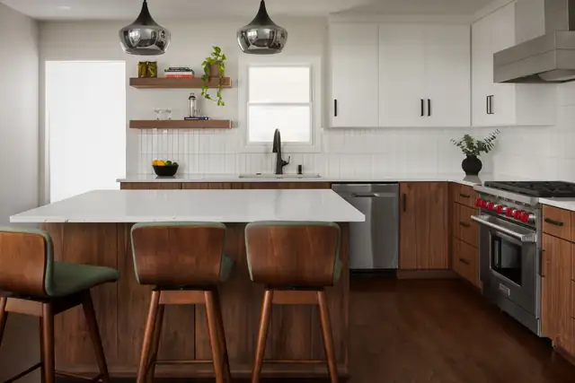 Mohawk Road kitchen remodel with walnut island seating, white upper cabinets, open wood shelves and a professional range